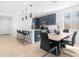 Modern kitchen with island, dark blue cabinetry, and white countertops at 1793 N Westfall Ln, Casa Grande, AZ 85122