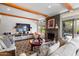 Living room with a stone fireplace, hardwood floors, and comfy seating at 19103 N 94Th St, Scottsdale, AZ 85255