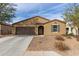 Single-story home with a two-car garage and desert landscaping at 20056 W Jackson St, Buckeye, AZ 85326