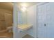 Bathroom with vanity, large mirror, and built-in storage at 232 E Woodman Dr, Tempe, AZ 85283