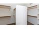 Large walk-in closet with ample shelving and hanging space at 2443 N Trenton --, Mesa, AZ 85207