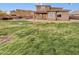 Large backyard with grassy lawn and two story home at 2522 W Brisa Dr, Phoenix, AZ 85085