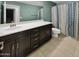 Clean bathroom, with dark brown vanity and shower/tub combo at 2522 W Brisa Dr, Phoenix, AZ 85085