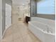 Primary bathroom with soaking tub and walk-in shower at 2522 W Brisa Dr, Phoenix, AZ 85085