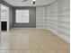 Bedroom with built-in bookshelves and ensuite bathroom at 2522 W Brisa Dr, Phoenix, AZ 85085