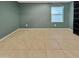 Spacious bedroom with tile floor and window at 2522 W Brisa Dr, Phoenix, AZ 85085