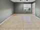 Bright bedroom featuring tile floors and large window at 2522 W Brisa Dr, Phoenix, AZ 85085