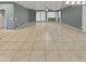 Bright and airy living room with tile flooring and access to backyard at 2522 W Brisa Dr, Phoenix, AZ 85085