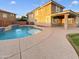 Inviting backyard pool with large patio and grassy area at 2522 W Brisa Dr, Phoenix, AZ 85085
