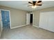 Bedroom with tile floors, ceiling fan and built in closet at 3617 W Harmont Dr, Phoenix, AZ 85051