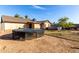 Backyard view showing trampoline and pool at 5147 W Seldon Ln, Glendale, AZ 85302