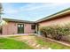 Private backyard space with a green lawn and stone pathway at 541 W Sweetwater Ave, Phoenix, AZ 85029