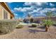 Relaxing backyard oasis with a sparkling pool and desert landscaping at 6413 W Copper Springs Rd, Phoenix, AZ 85083