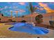 Relaxing freeform pool with water feature, enhancing outdoor living at 6413 W Copper Springs Rd, Phoenix, AZ 85083