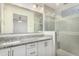 Modern bathroom with granite countertops, double sinks, and glass shower at 6850 E Mcdowell Rd # 26, Scottsdale, AZ 85257