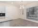 Bright dining area with modern chandelier and large window at 6850 E Mcdowell Rd # 26, Scottsdale, AZ 85257