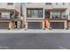 Modern townhome exterior with two-car garage and private balcony at 6850 E Mcdowell Rd # 26, Scottsdale, AZ 85257