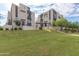 Modern townhouses with grassy landscaping at 6850 E Mcdowell Rd # 26, Scottsdale, AZ 85257