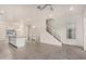 Open living area with modern staircase and tile flooring at 6850 E Mcdowell Rd # 26, Scottsdale, AZ 85257