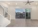 Bright living room with sliding glass doors leading to a balcony and city views at 6850 E Mcdowell Rd # 26, Scottsdale, AZ 85257