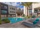 Community pool and spa with lounge chairs and BBQ area at 6850 E Mcdowell Rd # 26, Scottsdale, AZ 85257
