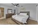 Bright bedroom with a queen-size bed, dresser, and an ensuite bathroom at 7323 E Lewis Ave, Scottsdale, AZ 85257