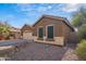 Brown house with stone accents and two windows at 8157 W Gibson Ln, Phoenix, AZ 85043