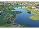 Bird's-eye view of a lake, landscaping, and homes at 9772 E Tranquility Way, Sun Lakes, AZ 85248