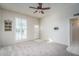 Living room featuring a ceiling fan and entryway view at 9912 W Cedar Dr, Sun City, AZ 85351