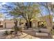 Single story home with desert landscaping and two car garage at 10040 E Happy Valley Rd # 2046, Scottsdale, AZ 85255