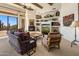 Spacious living room with fireplace, built-ins, and scenic views at 10040 E Happy Valley Rd # 2046, Scottsdale, AZ 85255