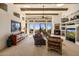 Open living room with exposed beams and expansive windows at 10040 E Happy Valley Rd # 2046, Scottsdale, AZ 85255