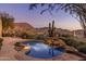 Inviting pool with mountain views and a serene waterfall feature at 10040 E Happy Valley Rd # 2046, Scottsdale, AZ 85255