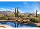 Relaxing pool area with mountain views and native plants at 10040 E Happy Valley Rd # 2046, Scottsdale, AZ 85255