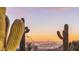 Stunning desert landscape with city lights at sunset at 10040 E Happy Valley Rd # 2046, Scottsdale, AZ 85255