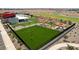 Community dog park with artificial turf and seating areas at 12421 E Bahia Ct, Florence, AZ 85132