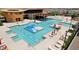 Aerial view of resort-style pool and spa with lounge chairs at 12421 E Bahia Ct, Florence, AZ 85132