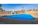 Relaxing backyard with a refreshing pool and a brick fireplace at 12820 N 29Th Dr, Phoenix, AZ 85029