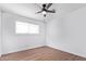 Spacious bedroom with wood floors and a ceiling fan at 12820 N 29Th Dr, Phoenix, AZ 85029