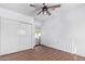 Light and airy bedroom featuring wood floors and a ceiling fan at 12820 N 29Th Dr, Phoenix, AZ 85029