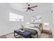 Spacious bedroom with ceiling fan and wood-look flooring at 12820 N 29Th Dr, Phoenix, AZ 85029
