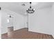 Bright dining room features hardwood floors and a modern chandelier at 12820 N 29Th Dr, Phoenix, AZ 85029