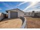Detached garage with a roll-up door and gravel driveway at 12820 N 29Th Dr, Phoenix, AZ 85029