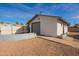 Detached garage with a large roll-up door and side yard at 12820 N 29Th Dr, Phoenix, AZ 85029