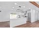 Modern kitchen with island, stainless steel appliances, and white cabinets at 12820 N 29Th Dr, Phoenix, AZ 85029