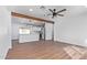 Living room with hardwood floors and open kitchen at 12820 N 29Th Dr, Phoenix, AZ 85029