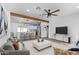Modern living room with open floor plan and TV at 12820 N 29Th Dr, Phoenix, AZ 85029