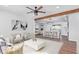 Open concept living room with kitchen view and stylish furnishings at 12820 N 29Th Dr, Phoenix, AZ 85029