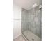 Large walk-in shower with gray tile and glass enclosure at 1831 N 77Th St, Scottsdale, AZ 85257