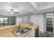 Kitchen with double sink, stainless steel dishwasher and view into living area at 1920 W Lindner Ave # 147, Mesa, AZ 85202